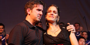 Jason and Courtney Atack stand to receive applause at the end of the Songs of Hope benefit concert.